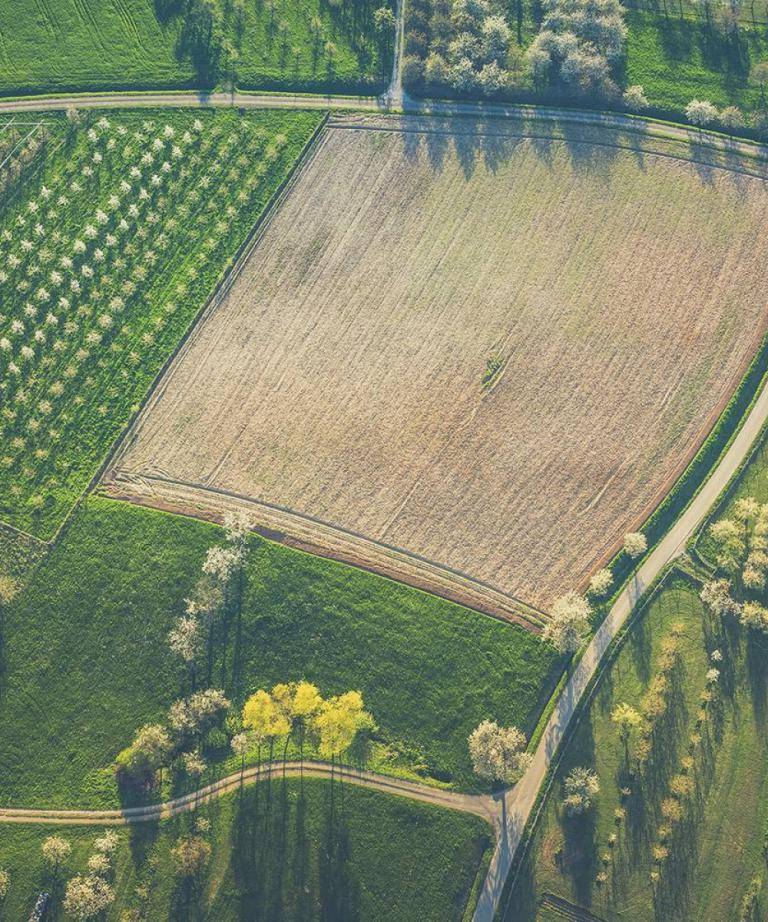 An aerial view from farmland and fields